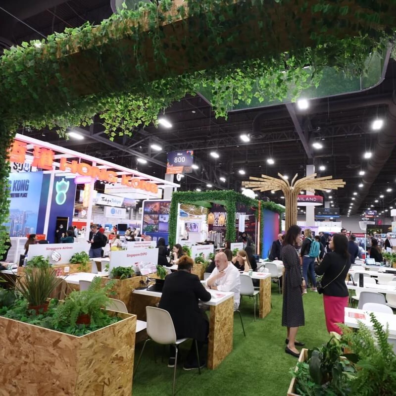 Green, nature focused booth at IMEX America