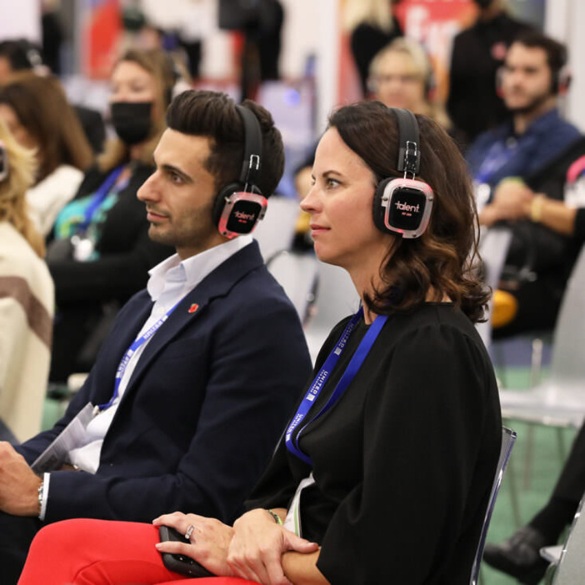 Event professionals attending a tech session during IMEX America
