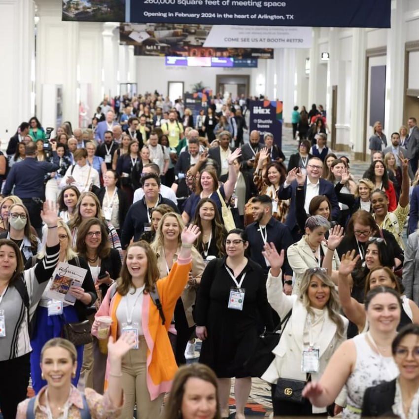 Event professionals walking towards the IMEX America show floor