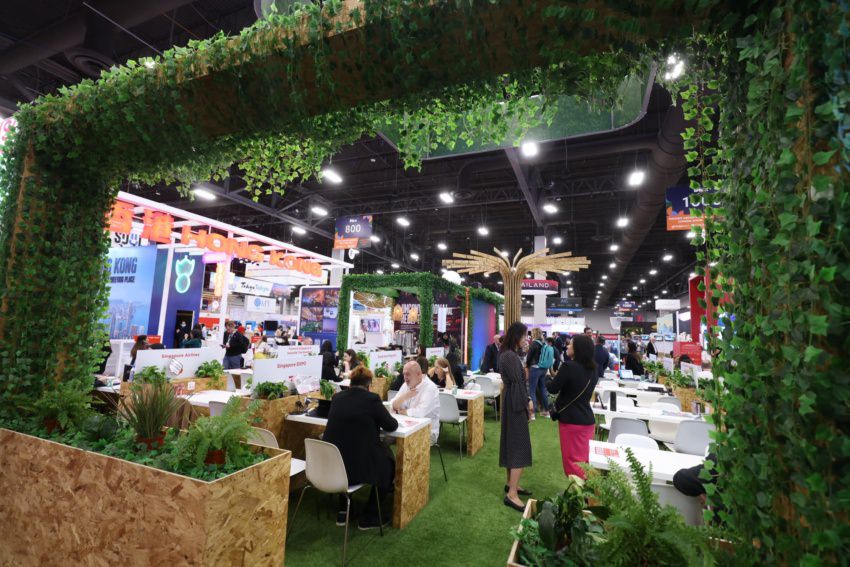 Seating at an IMEX green exhibitor booth